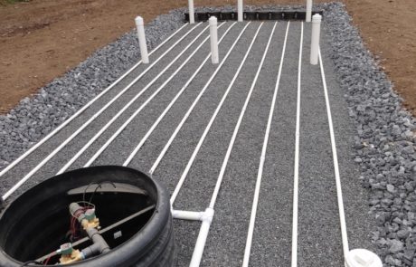 pvc pipes in a gravel bed
